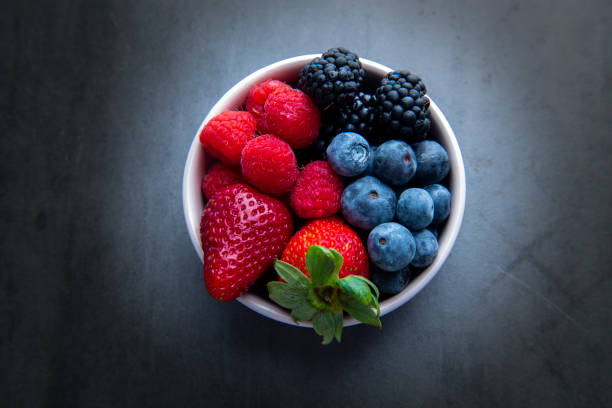 istock strawberries, blueberries, blackberries and raspberries 1194798808