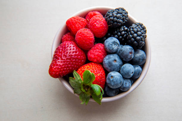 istock strawberries, blueberries, blackberries and raspberries 1194798828