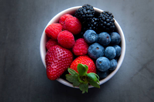 istock strawberries, blueberries, blackberries and raspberries 1194798856