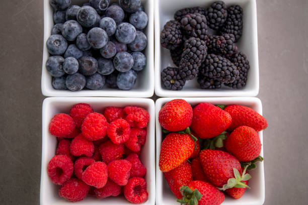 istock strawberries, blueberries, blackberries and raspberries 1194799439