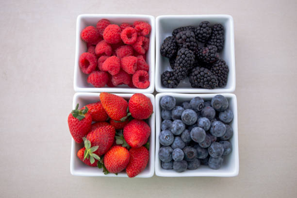 istock strawberries, blueberries, blackberries and raspberries 1194799451