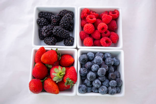 istock strawberries, blueberries, blackberries and raspberries 1194799531