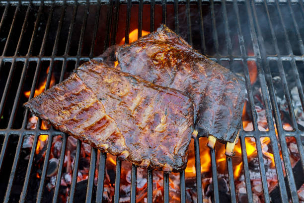 istock Spare beef ribs on BBQ grill with flame 1194799600