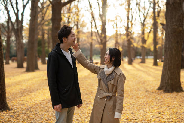 istock Couple flirting in park 1194802078