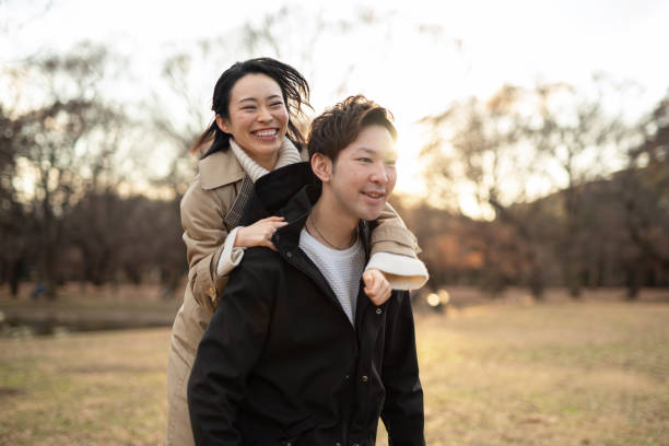 istock Woman hopping on boyfriend's back 1194802117