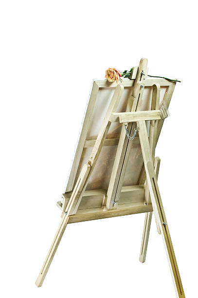 A picture of a Ukrainian village with an wooden easel lies on the background of a vase. Decorative art. Petrikovsky painting still life.