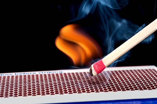 Matchstick on fire  lit match stock pictures, royalty-free photos & images