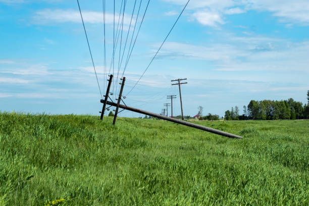istock fallen on the field pole with electricity 1194810868