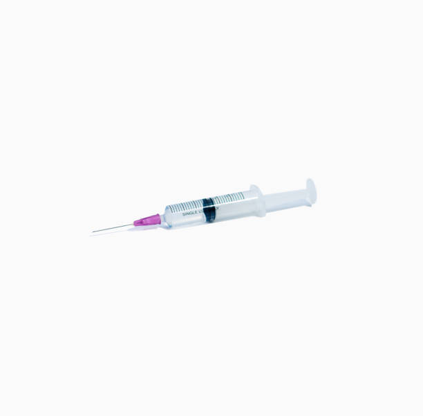 istock Hypodermic syringe on isolated white background 1194811995