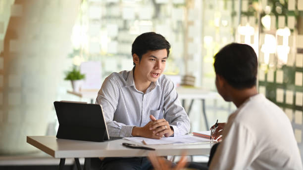 istock Consulting architecture working with partner on office desk. 1194812851