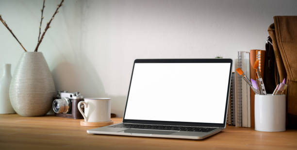 istock Close-up view of comfortable designer workplace with blank screen laptop computer and office supplies 1194812988