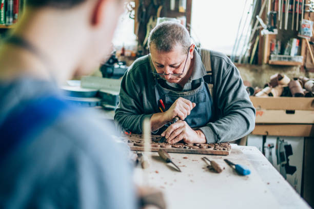 istock Father and son carpenters 1194817189