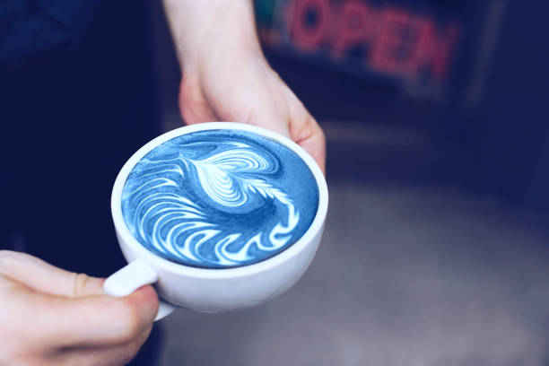 A cup of coffee in male hands.