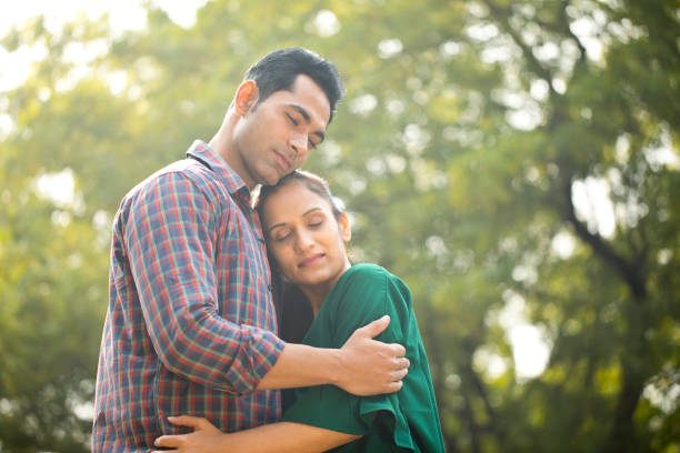 istock Indian couple embracing at park 1194822037