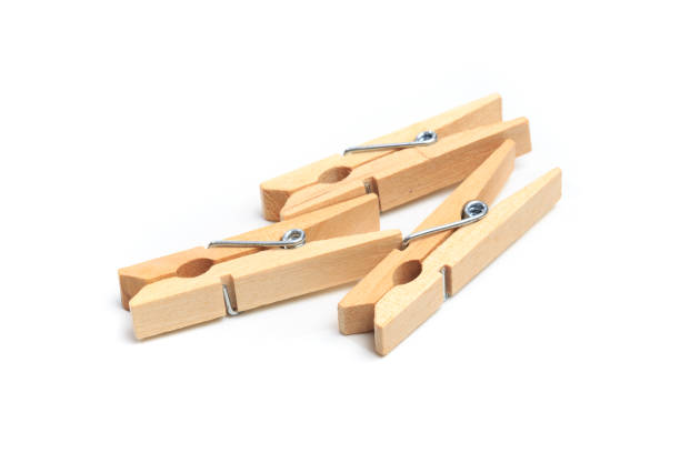 istock Brown wood clothes peg or clothespin on white background. 1194825194