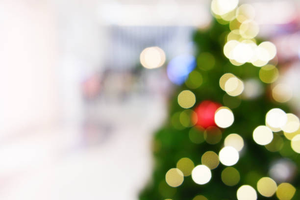 istock Christmas tree in shopping mall blurred background 1194827715
