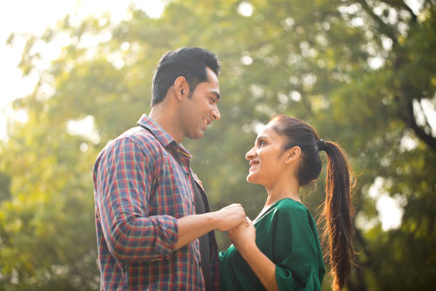istock Romantic couple at park 1194827818