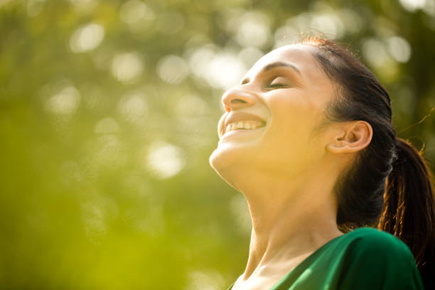 istock Laughing beautiful woman outdoor 1194828012
