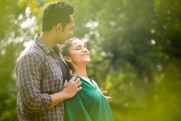 istock Indian couple embracing at park 1194828102