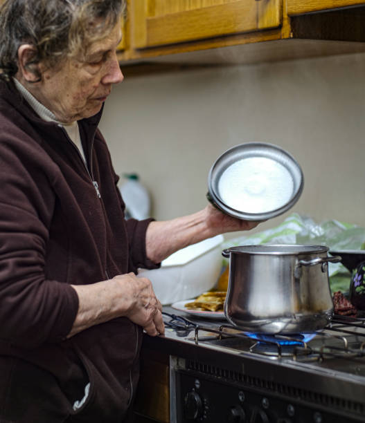 istock Elderly Woman cooking 1194829016