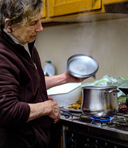 istock Elderly Woman cooking 1194829022