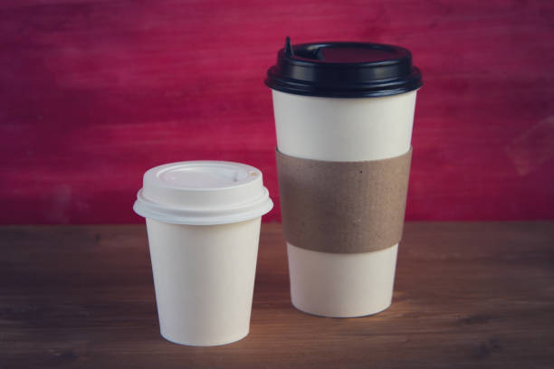 istock empty cardboard Cup on wooden background 1194829225