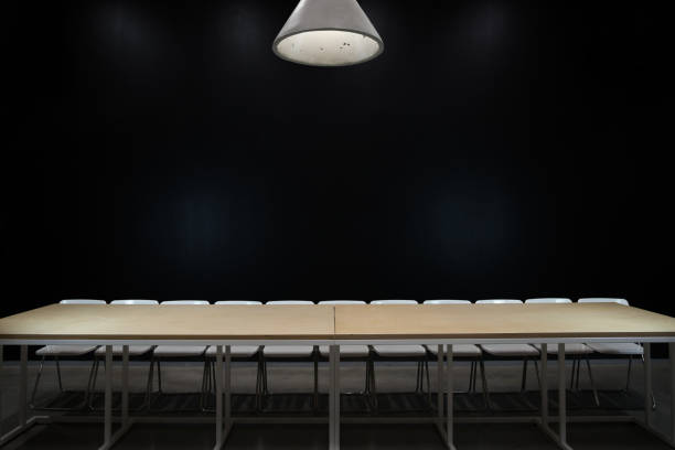istock empty table and chairs on black background the last supper 1194829275