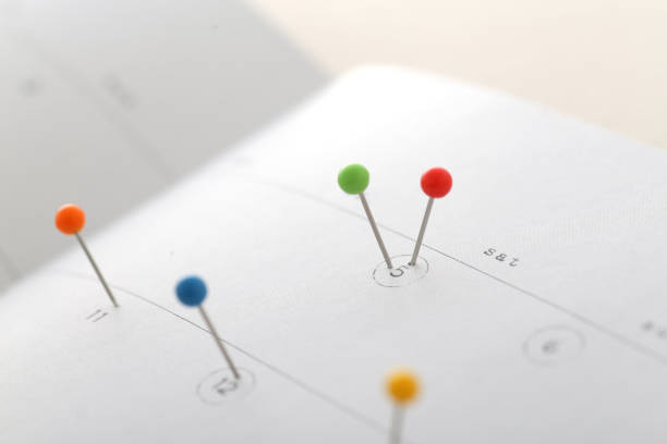 istock Calendar with colorful pins 1194829980