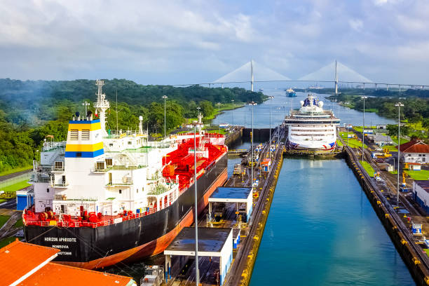 A cargo ship entering the Miraflores Locks in the Panama Canal Panama Canal, Panama - December 7, 2019: A cargo ship entering the Miraflores Locks in the Panama Canal, in Panama canal stock pictures, royalty-free photos & images