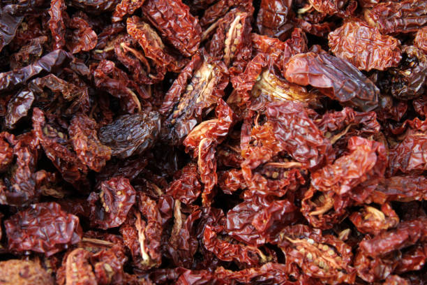 istock Dried tomatoes. Dry veggie or fruit. Tomato background. 1194832474