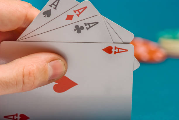 istock playing cards in a people hand 1194833070