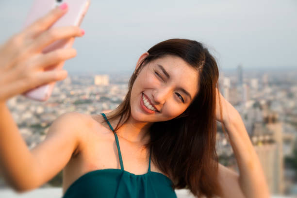 istock Woman in Bangkok taking selfie 1194833792