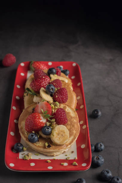 istock Pancakes with strawberries, banana and syrup. Copyspace 1194834253