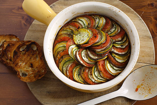 французский рататуй - zucchini gratin casserole squash стоковые фото и изображения