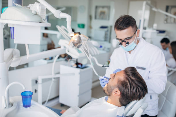 istock Young gentleman at the dentist 1194835277