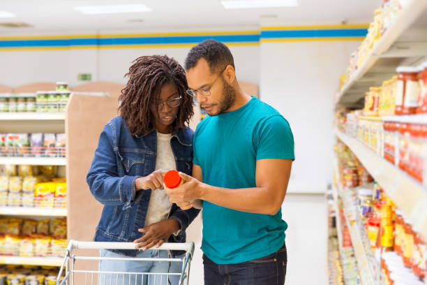 istock Front view of focused people looking at bottle 1194835374