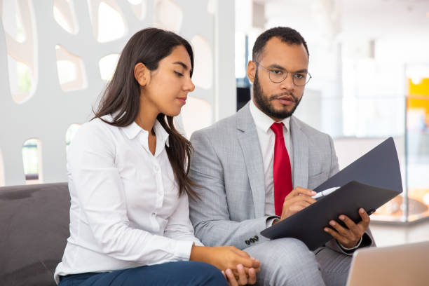 istock Professional business colleagues discussing contract 1194836307