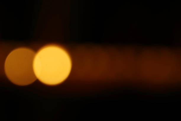 istock Orange candle light in bokeh background 1194838569