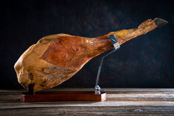 Iberian ham Iberic ham leg on wood at ham holder black hoof whole jamon iberico
