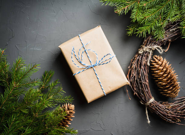 istock Christmas background with gifts and pine branches on the rustic background 1194839023