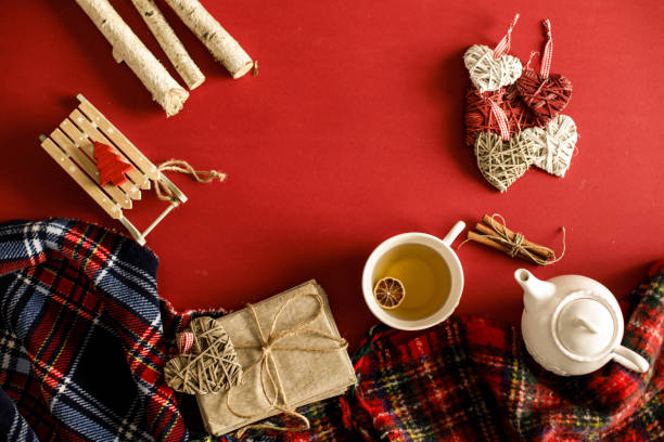istock Copy space of a Christmas themed flat lay on a red background 1194842941