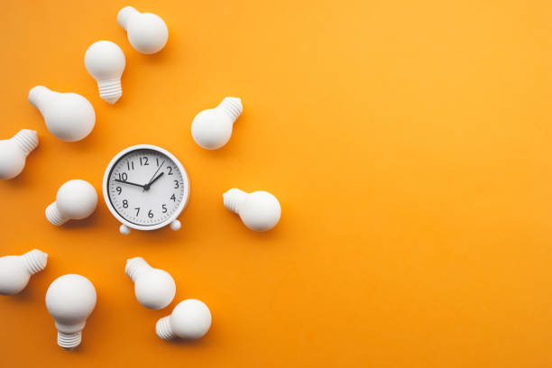 istock Time,dateline and creativity concepts with group of lightbulb and clock on pastel color background.Business solution.Performance of human 1194843100