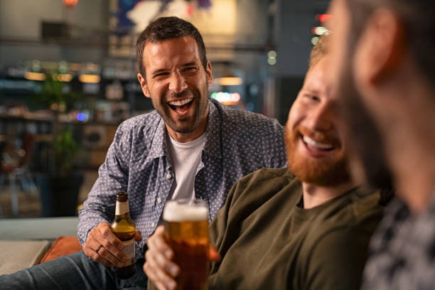istock Friends enjoying beer at pub 1194844079