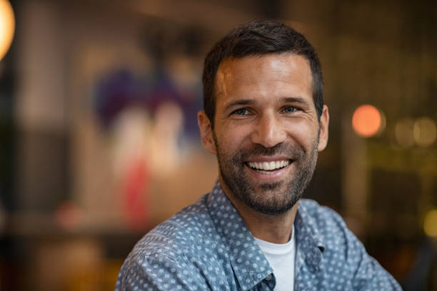 istock Happy young man at night indoor 1194844613