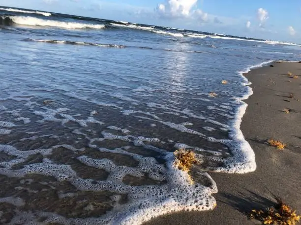 Photo of shallow water on the shore of the beach