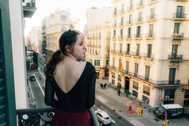 istock Woman on balcony in  Barcelona 1194845968