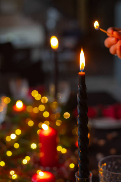 istock Table served for Christmas dinner, festive setting with decorations, burning candles, selective focus 1194846102