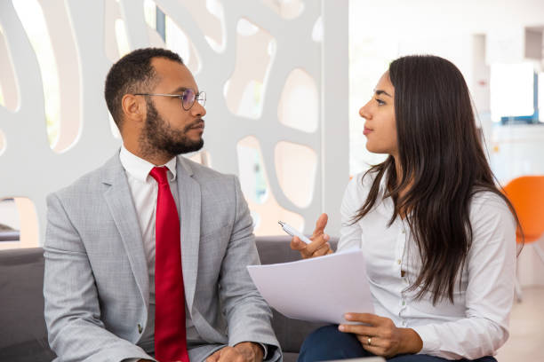 istock Professional young business colleagues discussing contract 1194846127