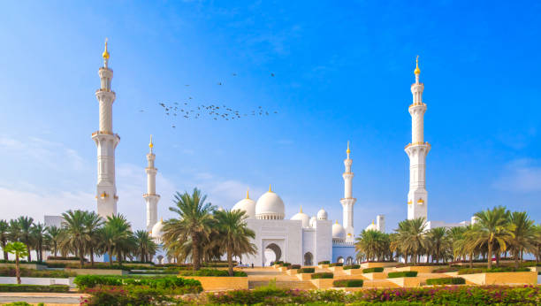 Abu Dhabi, UAE - December 10. 2019. the snow-white imposing Sheikh Zayed Mosque in Abu Dhabi is a popular attraction. The inside of the mosque must not be entered by tourists, it is reserved for the faithful for the holidays. The mosque is made of white marble with many inlays. Women may only enter them with appropriate respectful clothing.