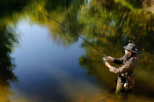 istock Fishermen in the autumn lake 119484791